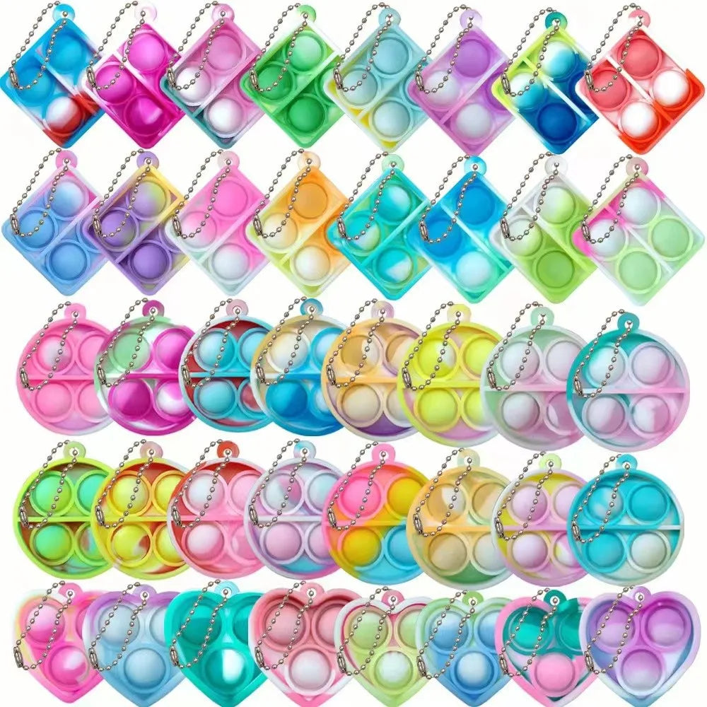 Mini llaveros de silicona con burbujas de colores y formas variadas