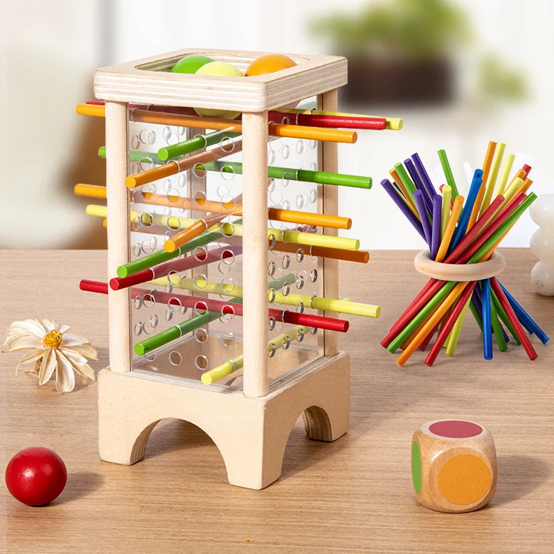 Torre de madera con palitos de colores, bolas, dado y aro
