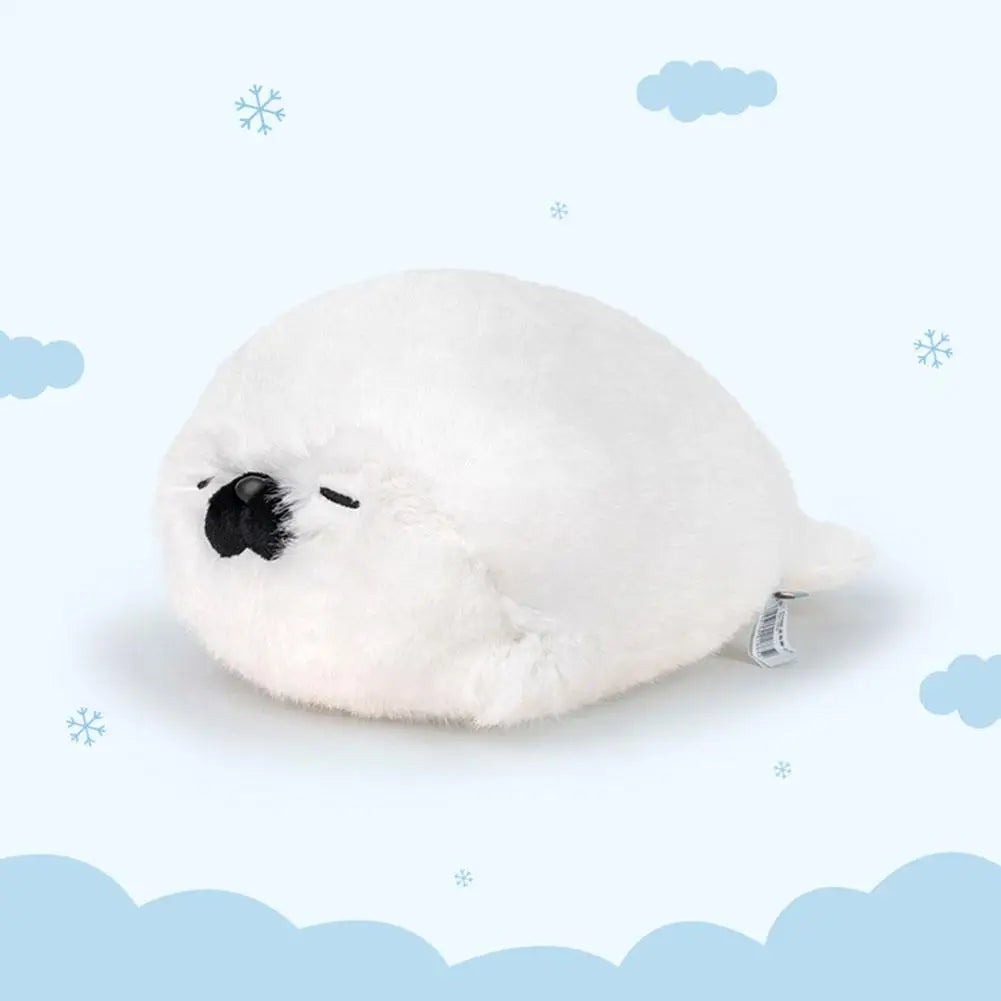 Foca de peluche blanca tumbada