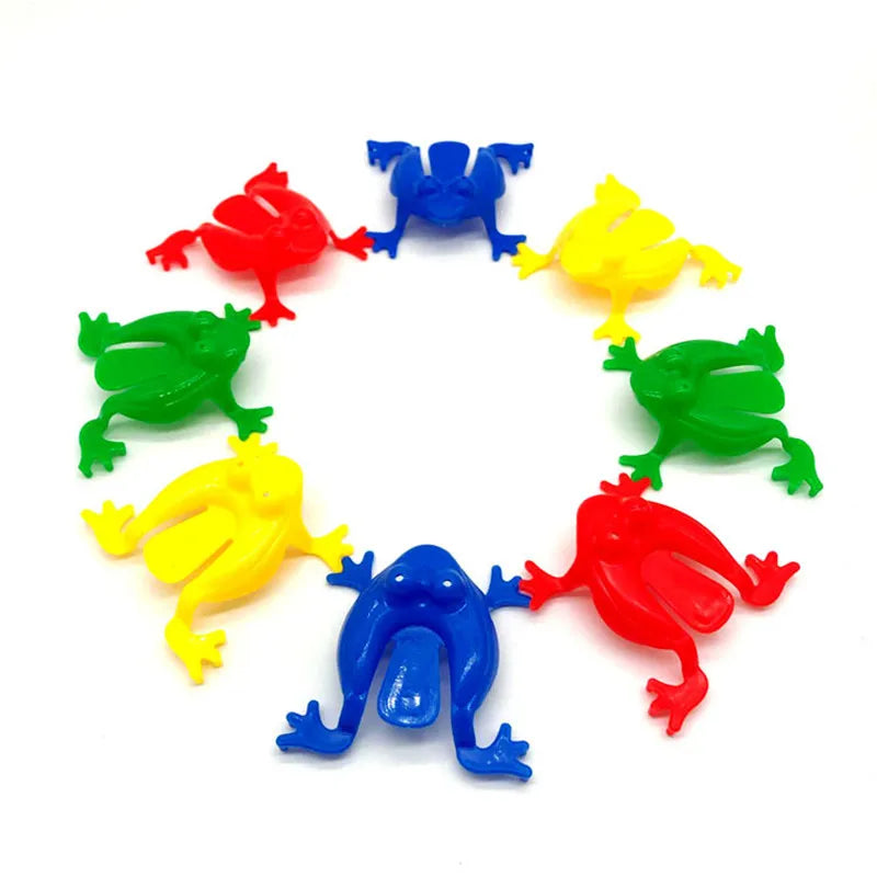 Ranas saltarinas de plástico de colores en círculo