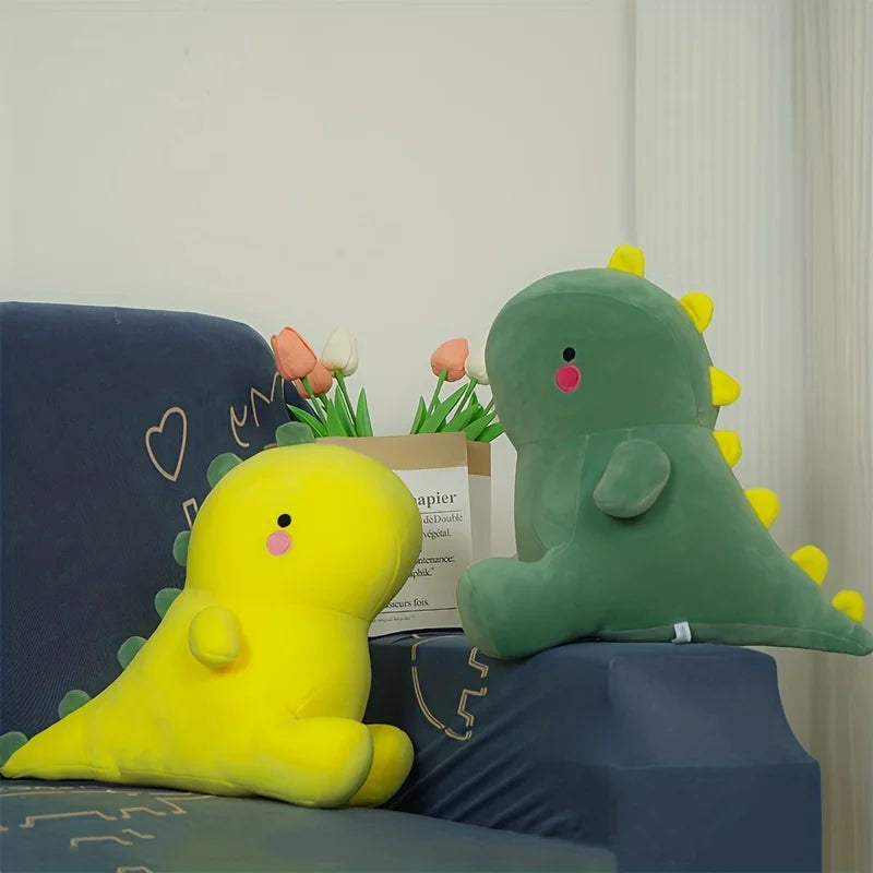 Dinosaurios de peluche amarillo y verde
