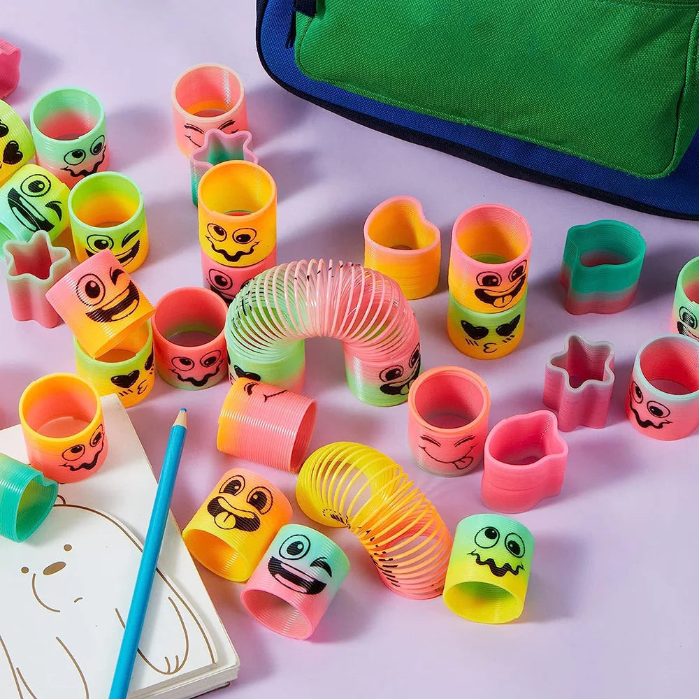 Mini muelles de arcoíris de colores con caritas y dibujos