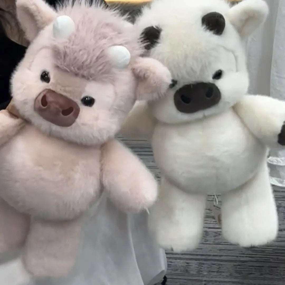 Vacas Highland de peluche rosa y blanca