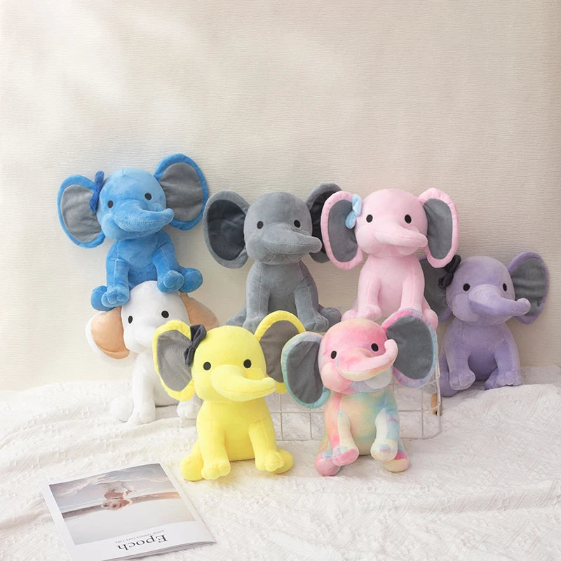 Elefantes de peluche azul, gris, rosa, lila y amarillo