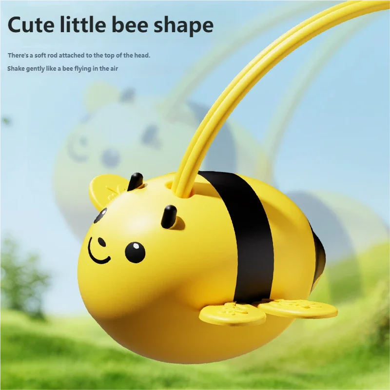 Abeja del juego colgando del alambre flexible