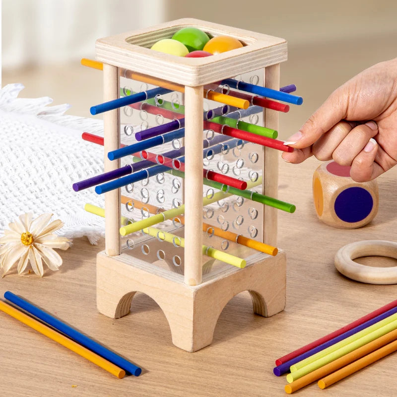 Jugador sacando un palito de la torre