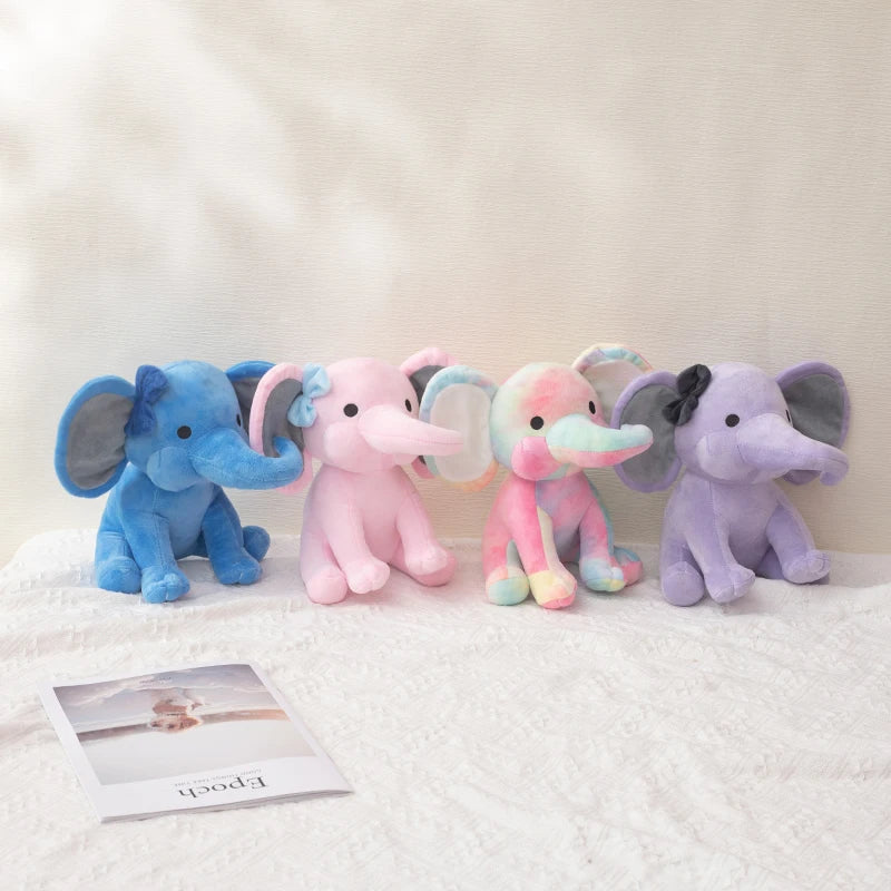 Elefantes de peluche azul, rosa, arcoíris y lila